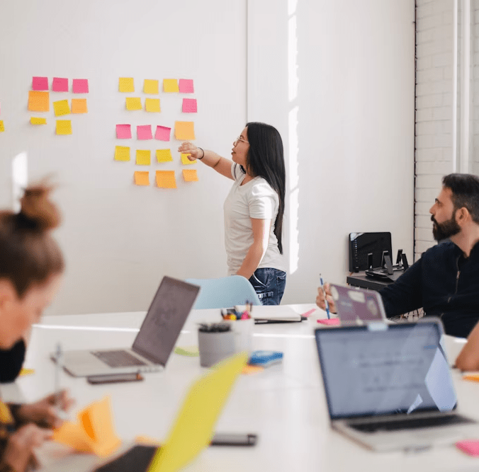 teacher explaining in front of class