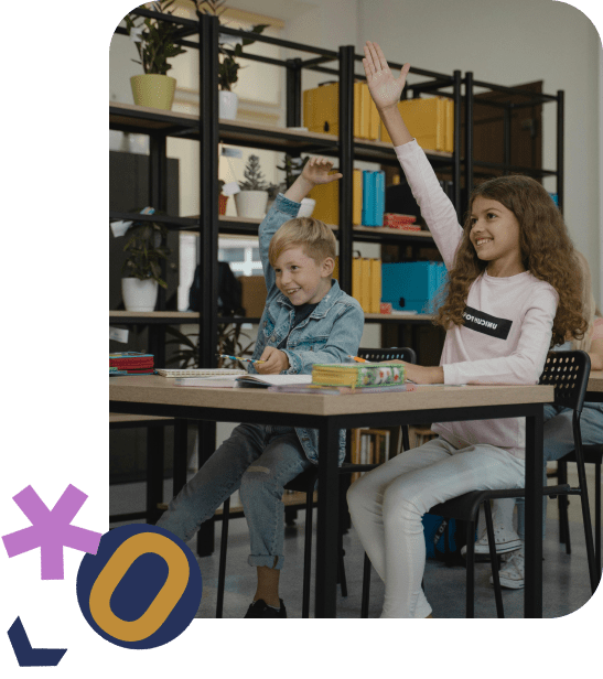 child sitting behind computer